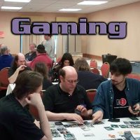 Three tables of people playing games